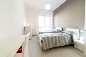Posteľ alebo postele v izbe v ubytovaní Casa Roncalli