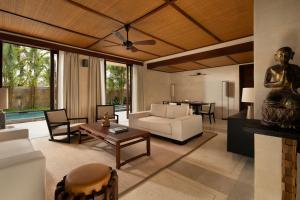 a living room with a couch and a table at COMO Shambhala Estate in Payangan +168 photos