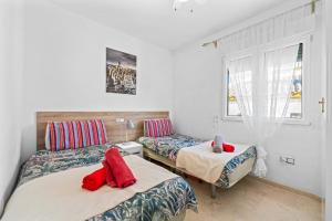 En eller flere senge i et værelse på Nice apartment in a wonderful area + 23 billeder