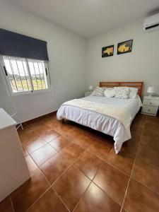 Postel nebo postele na pokoji v ubytování Villamaría, Alma de Despeñaperros