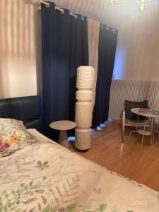 a bedroom with a bed and a table and chairs at Übernachten in Stuttgart