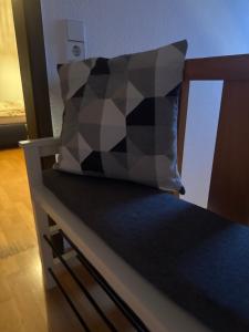 a pillow sitting on top of a bed at Übernachten in Stuttgart