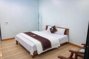 En eller flere senge i et værelse på Ciao Homestay