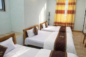 En eller flere senge i et værelse på Ciao Homestay + 24 billeder