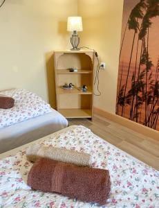 Postel nebo postele na pokoji v ubytování Pipacs Vendégház