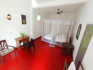 Giường trong phòng chung tại Abhilashi Guest house