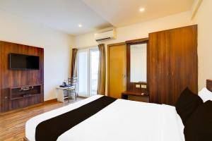 Et tv og/eller underholdning på Super Townhouse Whitefield Bangalore