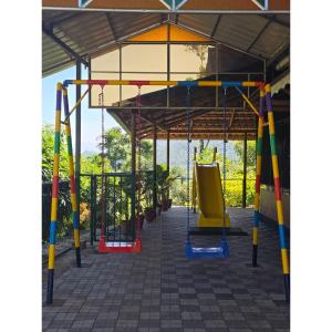 an empty playground with a swing at Sylora Meadows Private Pool Villa ,Vagamon in Pīrmed +39 photos