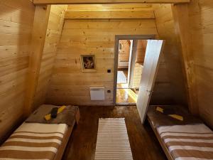 Giường trong phòng chung tại Gora The Alpine Nest
