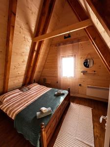 Giường trong phòng chung tại Gora The Alpine Nest