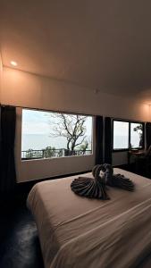 En eller flere senge i et værelse på Nunggalan Octopus 1