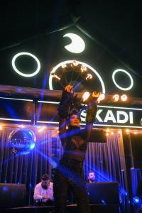 a woman holding a ferris wheel in a bar at Oksijen Zone Hotel & Spa - Full Board Plus in Uludag