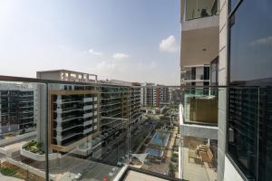 an aerial view of a city with buildings at Roomook Cozy studio in Dubai
