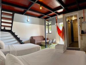 En eller flere senge i et værelse på Ardour Lodge "A" Wing