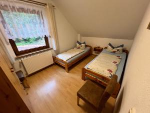 Postel nebo postele na pokoji v ubytování Ferienwohnungen Wiedemann WE 4