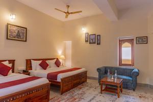 En eller flere senge i et værelse på Estherea Bagh Ranthambhore Tiger Territory + 21 billeder