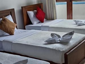 Postel nebo postele na pokoji v ubytování Drizzle Ridge Villa + 9 fotografií