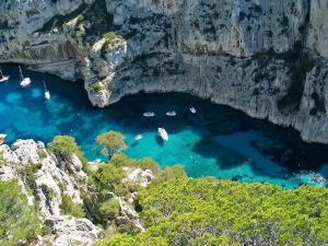 an aerial view of a cove with boats in the water at Ô51 in Marseille