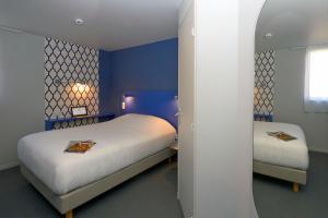 Een bed of bedden in een kamer bij Coto Hotel