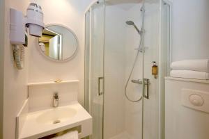 Een badkamer bij Coto Hotel