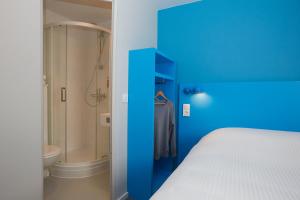 Een bed of bedden in een kamer bij Coto Hotel