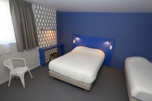 Een bed of bedden in een kamer bij Coto Hotel