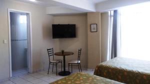 TV a/nebo společenská místnost v ubytování Hotel La Vista