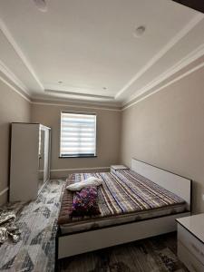 Postel nebo postele na pokoji v ubytování Hotel Turist Samarkand