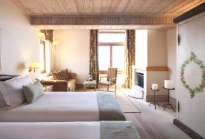 En eller flere senge i et værelse på Santa Marina Arachova Resort & Spa