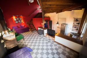 an overhead view of a living room with red walls at La Mamunia in Las Gaviotas