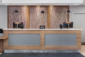 a lobby with a reception counter with two at Homewood Suites by Hilton Toronto-Ajax in Ajax +73 photos