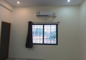 a room with a window with a air conditioner at Hotel Pampa Sarovar in Chhatarpur +31 photos