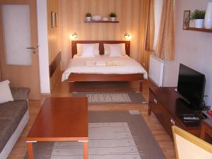Postel nebo postele na pokoji v ubytování Gonda Apartments