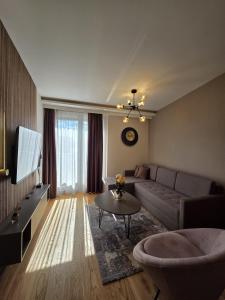 a living room with a couch and a table at Dukk in Belgrade