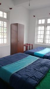 En eller flere senge i et værelse på Frosty Heaven Guest House