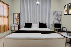 En eller flere senge i et værelse på Hotel O A In Residency + 21 billeder