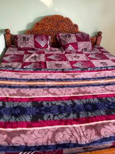 En eller flere senge i et værelse på CR Residency