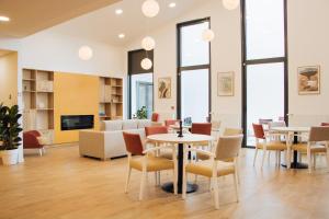 Posezení v ubytování Résidence Nouvelles Sylphides Carrières-sous-Poissy + 30 fotografií