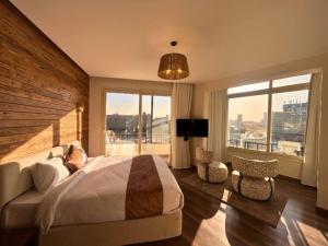 Ένα ή περισσότερα κρεβάτια σε δωμάτιο στο Elevana Boutique hotel