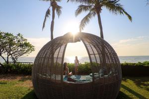 a group of people in a wicker pod with the ocean at Sheraton Hua Hin Resort & Spa in Cha Am +150 photos