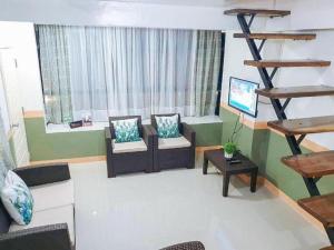 Posezení v ubytování RedDoorz near SGM Condotel Villa Beach Iloilo