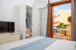 Et tv og/eller underholdning på Appartamenti Residence Poseidone