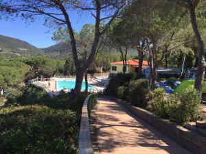 a view of the pool from the house at Camping Village Stella Mare in Lacona