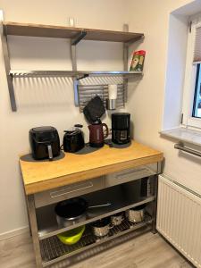a kitchen with a counter with a coffee maker at FeWo Am Neckarsteig in Neckarsteinach +7 photos