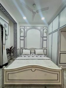 a bedroom with a large bed in a room at Lalluji Luxe in Jaipur
