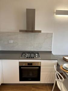 a kitchen with a stove and a counter top at Mugello Circuit & Florence charm in Scarperia