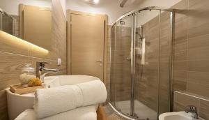 a bathroom with a shower and a sink and a toilet at Carbonera 4 - casetta vicina alla Stazione in Tirano