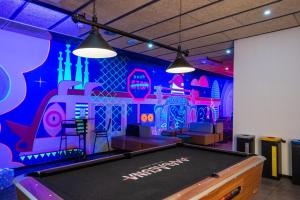 a room with a pool table in a room at Malacuna Barcelona in Barcelona