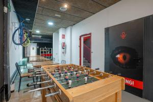 a room with a chess board on a table at Malacuna Barcelona in Barcelona