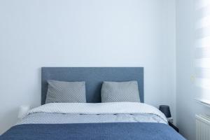 En eller flere senge i et værelse på Apartment-Gravensteen